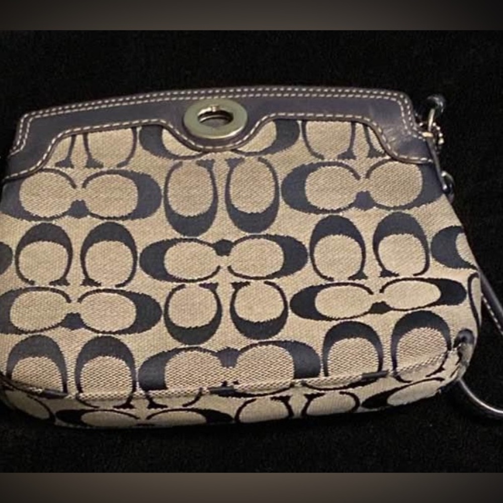 Coach wristlet with clamp